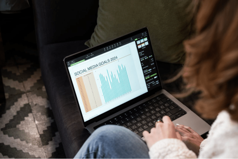 Person analyzing social media goals on a laptop screen.